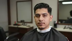 Male Barber Apprentice Portrait Stock Photo