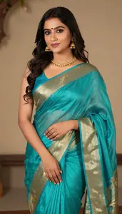 Woman In Aqua Silk Saree With Gold