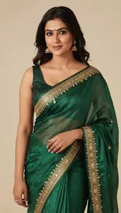Woman In Bottle Green Silk Saree With Embroidery