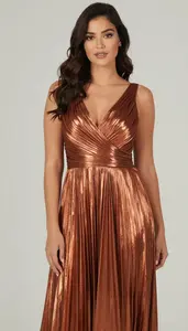 Woman In Copper Metallic Pleated Gown