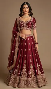 Woman In Garnet Silk Lehenga With Zari