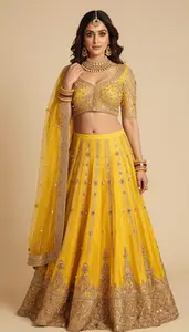 Woman In Golden Yellow Net Lehenga