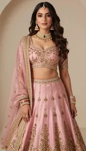 Woman In Ice Pink Silk Lehenga With Gold Work