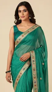 Woman In Jade Georgette Saree With Embroidery
