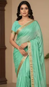 Woman In Jade Georgette Saree With Border