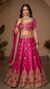 Woman In Magenta Silk Lehenga With Gold Work