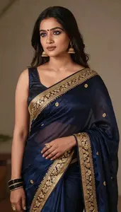 Woman In Midnight Silk Saree With Gold Embroidery