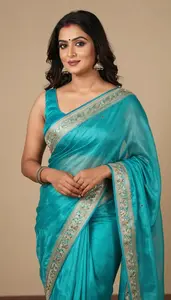 Woman In Turquoise Silk Saree With Embroidery