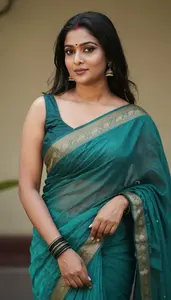 Woman In Viridian Saree
