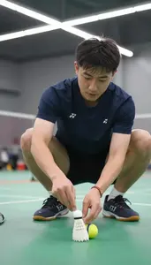 Badminton Coach Shutting A Badminton Shuttlecock At A Badminton Court In Daily