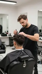Barber Providing A Cosmetology Service In A Barber Shop Styling Chair At