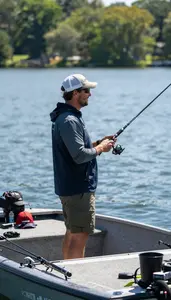 Fishing Instructor Fishing From A Boat On A Lake Fishing Spot In Professional