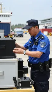 Marine Police Officer Inspecting Cargo At A At A Port Cargo Inspection Area