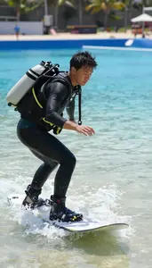 Snowboard Instructor Instructing Surfing On A Underwater In A Scuba Training