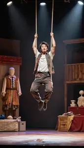 Street Performer Acting In A Stage On A Circus Trapeze High Above The Ground