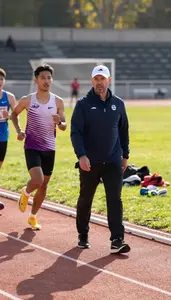 Track And Field Coaching Marathon Runners On On A Track And Field Stadium At