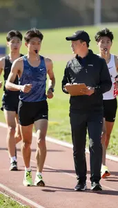 Track And Field Coaching Marathon Runners On On A Running Trail In Daily Work