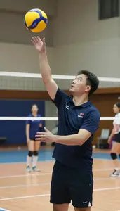 Volleyball Coach Spiking A Volleyball On On A Volleyball Court At Workplace