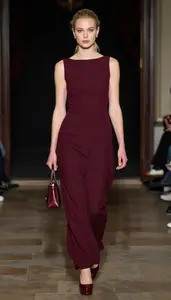 Fashion Forward Burgundy Dramatic Gown Stock Photo