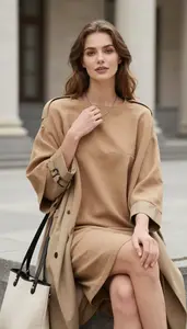 Fashion Forward Camel Poncho Dress Stock Photo