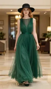 Fashion Forward Emerald Green Tulle Overlay Gown Stock Photo