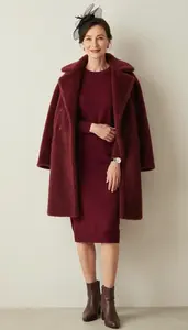 Graceful Woman In Sweater Dress Stock Photo