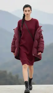 Modern Woman In Oversized Sweater Dress Stock Photo