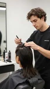 Cosmetologist Providing A Cosmetology Service In A Barber Shop Styling Chair
