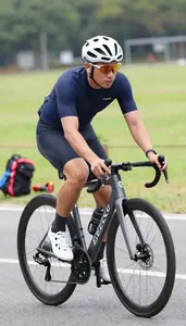 Cycling Coach Cycling On A Road On A Cycling Road Route In Daily Work
