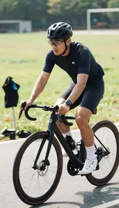 Cycling Coach Cycling On A Road On A Cycling Road Route At Professional Venue