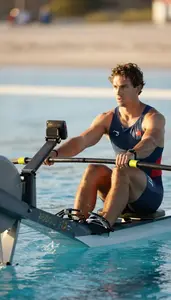 Diving Coach Rowing On A Rowing In An Olympic Size Swimming Pool In Professional