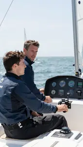 Flight Instructor Teaching Sailing Techniques On In A Driving School Car In