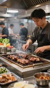Grill Cook Grilling Meat On A In A Busy Restaurant Kitchen At Work Location