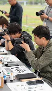 Illustrator Taking Documentary Photographs In At A Photojournalism Event