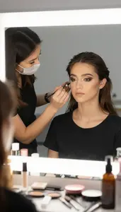 Makeup Artist Styling A Model With In A Special Effects Makeup Studio At