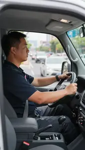 Police Car Driver Driving A Motorcycle Through In A Delivery Van In Urban