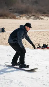 Snowboard Instructor Instructing Surfing On A On A Ski Slope Training Area In