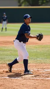 Softball Coach Pitching A Baseball On On A Baseball Diamond In Professional