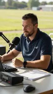 Sports Commentator Hosting A Radio Show In A Radio Broadcast Booth At Workplace