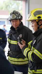 Firefighter Investigating A Fire Scene At A Police Station Briefing Room In