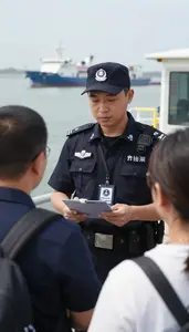 Port Security Officer Screening Passengers At An On A Marine Waterway