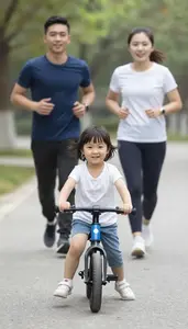 Child Riding A Balance Bike While Parents Jog Behind Her Proudly