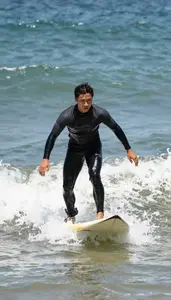Swimming Coach Surfing Wave Beach On A Beach With Ocean Waves In Professional