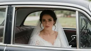 Bride Sitting Alone In A Vintage Car Looking Nervous Before The Ceremony