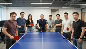 Colleagues Having A Ping Pong Match In A Tech Startup Break Room