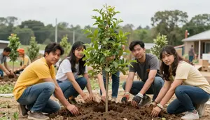 Community Members Planting A Tree Together In A Revitalization Project