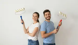 Couple Renovating Their New House With Paint Rollers And Laughter
