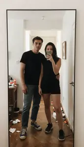 Couple Taking A Mirror Selfie In A Beautifully Messy Home Hallway