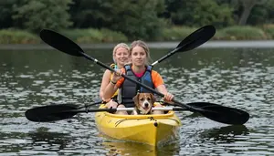 Family Kayaking On A Calm Lake With A Dog In The Boat