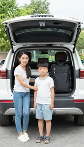 Family Loading Luggage Into An Suv Preparing To Leave On Vacation